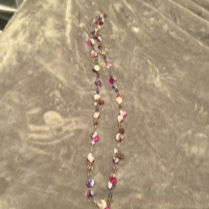 Fun necklace in pinks and purples.   Mix of stones and metal. About 24 inch long